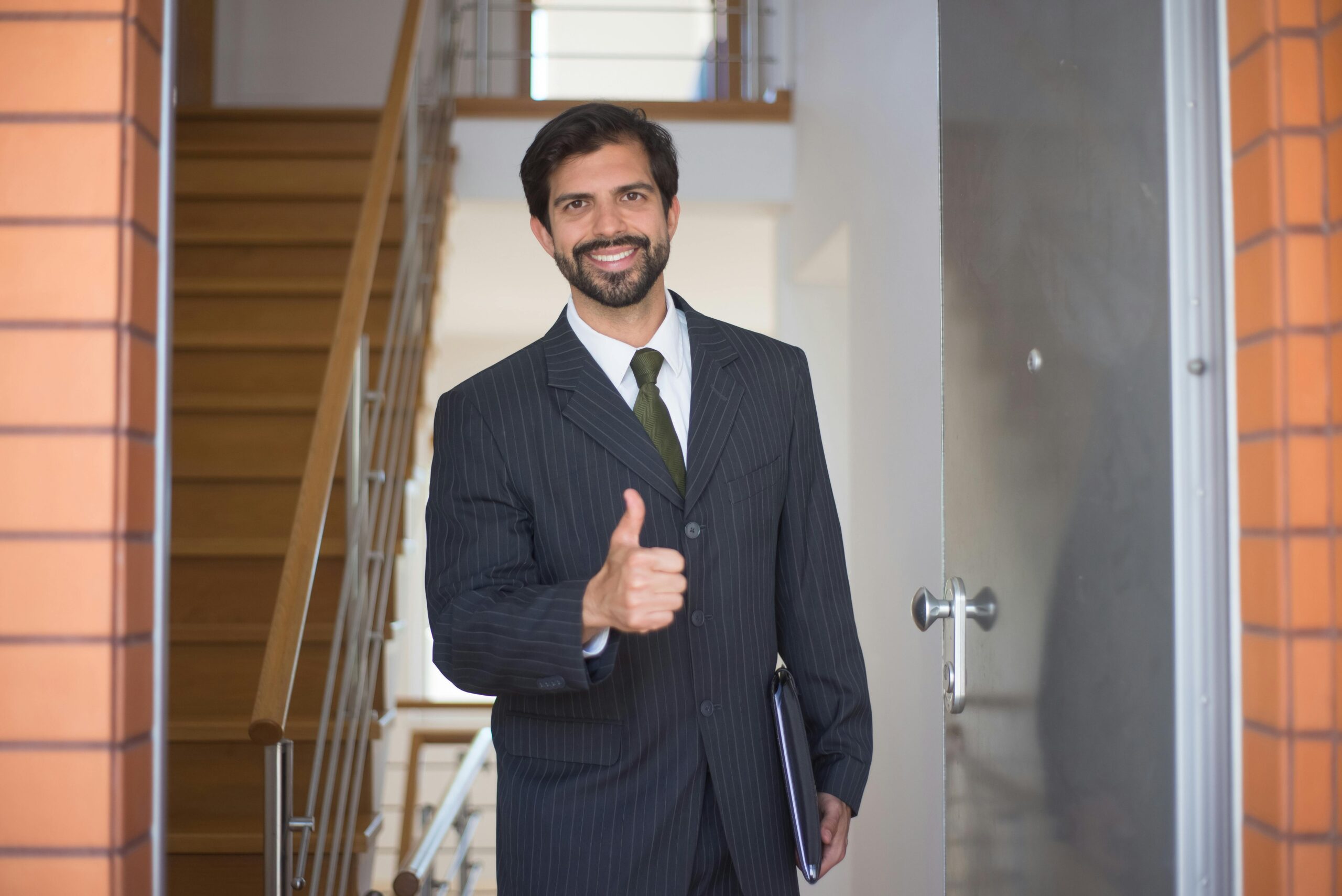 A salesman smiling and giving a thumbs up